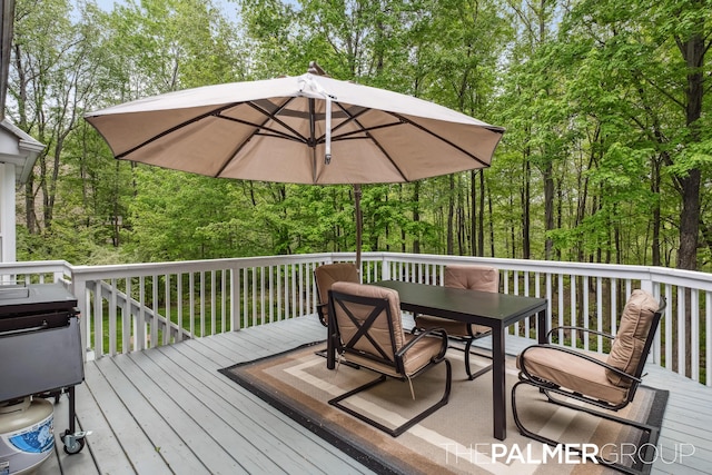 7149 Armadale Ct NE, Belmont, MI 49306 - wooden deck with outdoor dining space