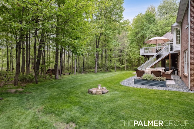 7149 Armadale Ct NE, Belmont, MI 49306 - view of grassy yard featuring an outdoor living space, a deck, and stairs