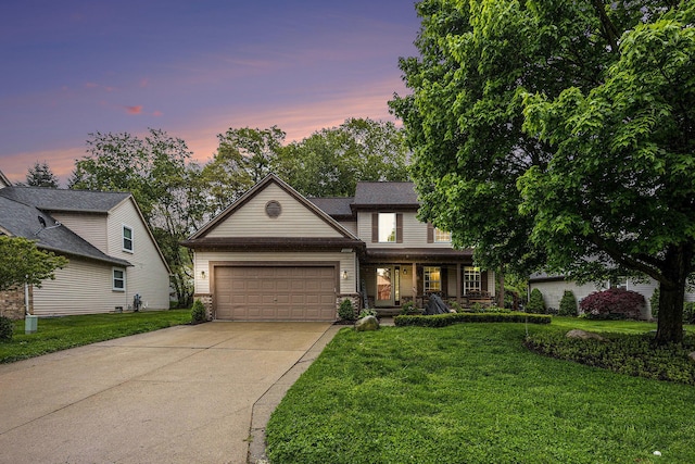 3311 Hickory Dr, Lake Orion, MI 48359 - traditional home with concrete driveway, a garage, a yard, and covered porch