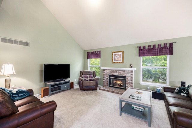 3311 Hickory Dr, Lake Orion, MI 48359 - living area with high vaulted ceiling, carpet floors, a fireplace, and baseboards
