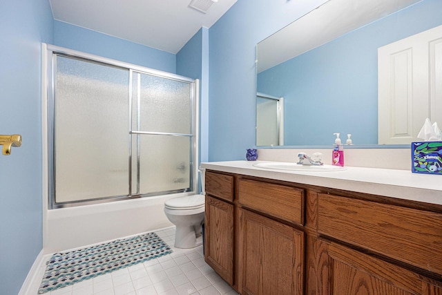 3311 Hickory Dr, Lake Orion, MI 48359 - full bathroom with vanity, toilet, shower / bath combination with glass door, and tile patterned floors