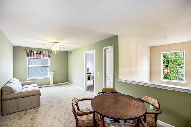 3311 Hickory Dr, Lake Orion, MI 48359 - living room featuring a ceiling fan, light colored carpet, and baseboards
