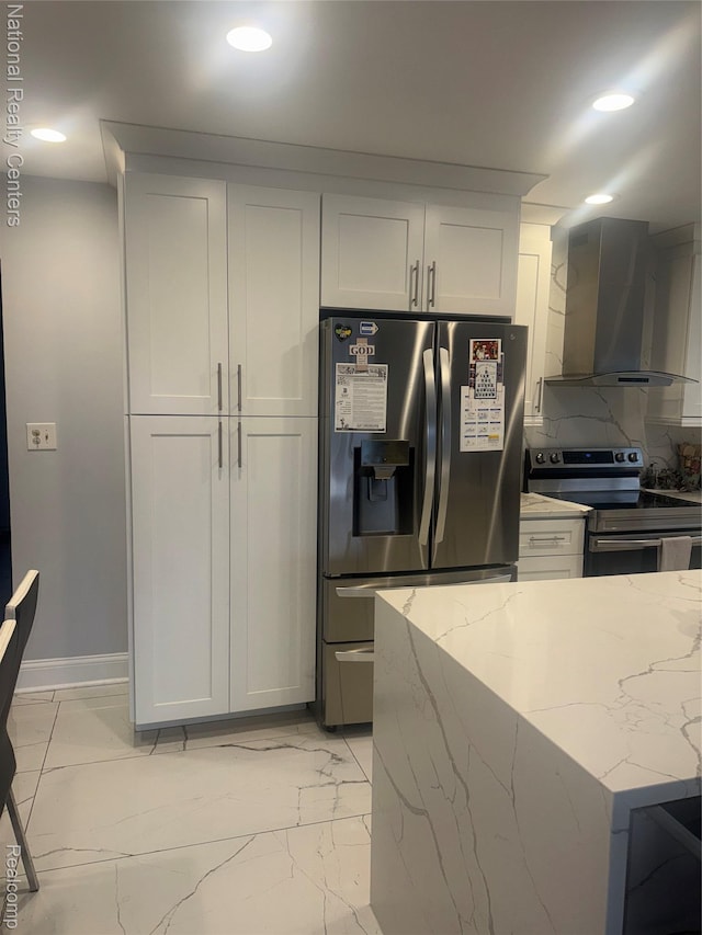 38217 Pinebrook Dr, Sterling Heights, MI 48310 - kitchen featuring stainless steel appliances, wall chimney range hood, light marble finish flooring, light stone counters, and white cabinetry