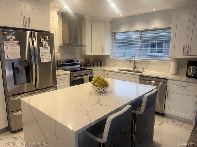 38217 Pinebrook Dr, Sterling Heights, MI 48310 - kitchen with appliances with stainless steel finishes, a sink, wall chimney range hood, light marble finish floors, and recessed lighting