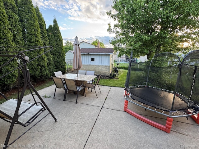 38217 Pinebrook Dr, Sterling Heights, MI 48310 - view of patio / terrace with a trampoline and outdoor dining area