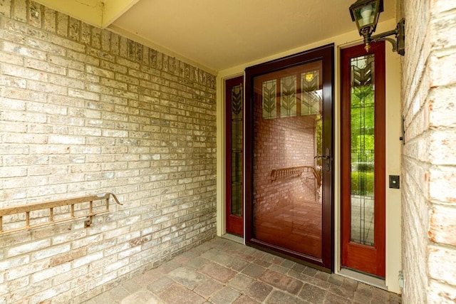 4936 Ravine Ct, Ann Arbor, MI 48105 - view of exterior entry featuring brick siding