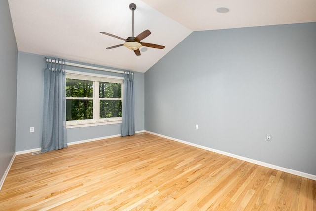 4936 Ravine Ct, Ann Arbor, MI 48105 - spare room featuring ceiling fan, vaulted ceiling, light wood-style flooring, and baseboards
