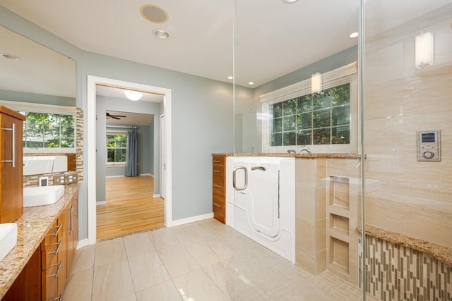 4936 Ravine Ct, Ann Arbor, MI 48105 - full bath featuring double vanity, baseboards, recessed lighting, and tile patterned floors