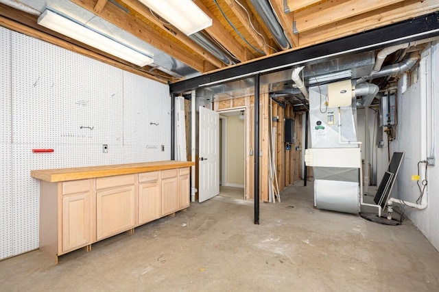 4936 Ravine Ct, Ann Arbor, MI 48105 - unfinished basement with a workshop area and heating unit