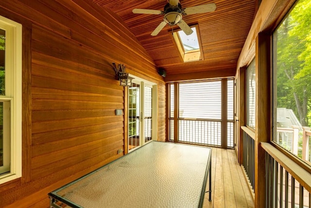 4936 Ravine Ct, Ann Arbor, MI 48105 - unfurnished sunroom featuring a ceiling fan, a skylight, wooden ceiling, lofted ceiling, and wood-type flooring