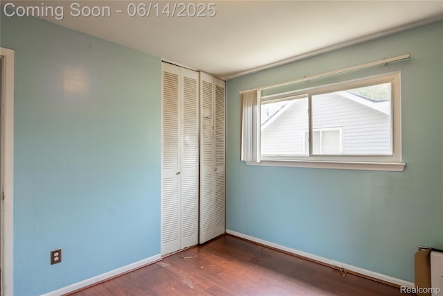 5633 Detroit St, Flat Rock, MI 48125 - unfurnished bedroom with a closet and wood finished floors