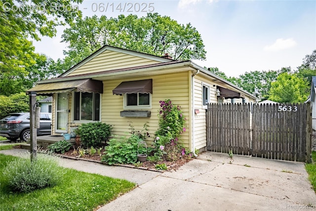 5633 Detroit St, Flat Rock, MI 48125 - view of front of home with a chimney