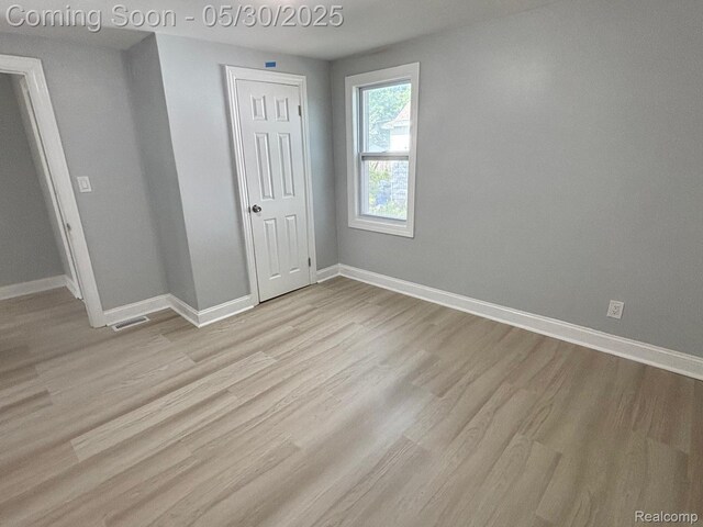 11005 Dodge Ave, Warren, MI 48089 - unfurnished bedroom with baseboards, wood finished floors, and a closet