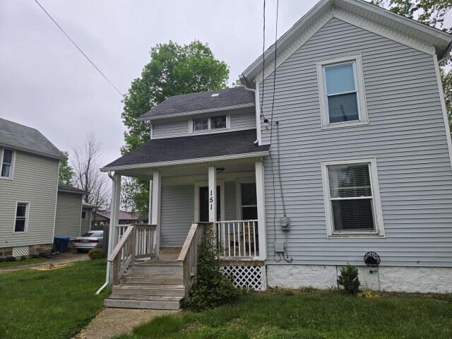 151 E Corey St, Bronson, MI 49028 - view of front of house with covered porch and a front yard