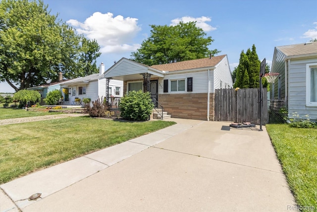 2562 Downing St, Melvindale, MI 48122 - view of front of house with brick siding and covered porch
