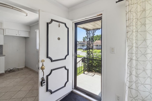 2562 Downing St, Melvindale, MI 48122 - foyer entrance featuring light tile patterned floors and ornamental molding