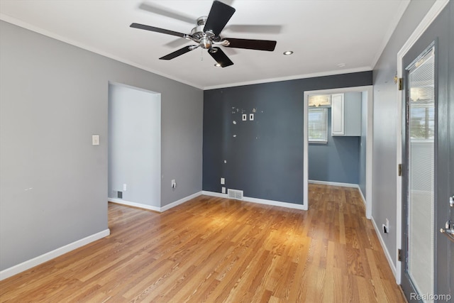 2562 Downing St, Melvindale, MI 48122 - spare room with ceiling fan, light wood-type flooring, and crown molding