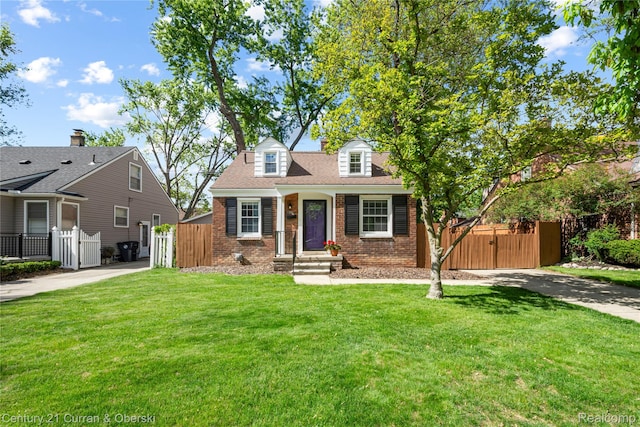 1392 Dorothea Rd, Berkley, MI 48072 - cape cod-style house with a gate, brick siding, and concrete driveway
