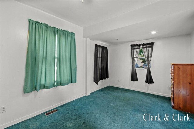 902 Turner Ave, Muskegon, MI 49442 - carpeted spare room featuring baseboards