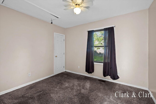 902 Turner Ave, Muskegon, MI 49442 - spare room with attic access, carpet floors, a ceiling fan, and baseboards