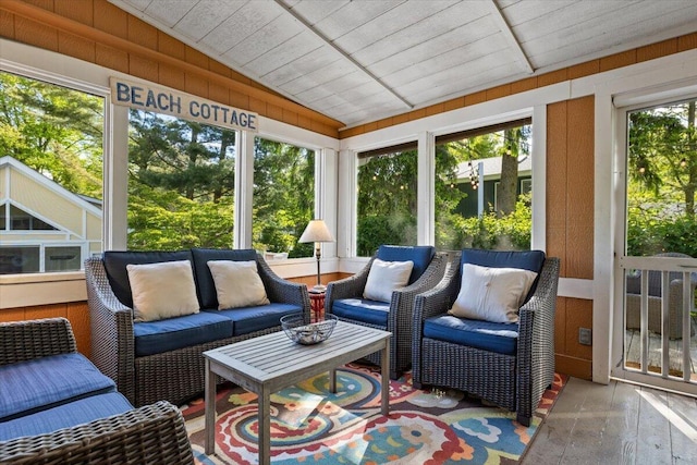 10251 Smith Rd, Union Pier, MI 49129 - sunroom featuring wood finished floors, wood walls, an outdoor living space, and lofted ceiling