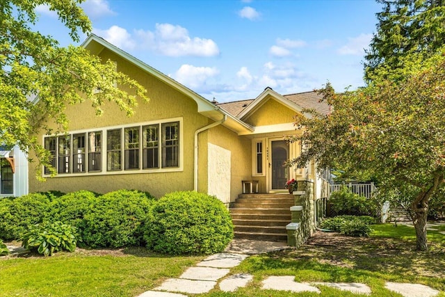 10251 Smith Rd, Union Pier, MI 49129 - view of front of house featuring stucco siding and a front yard