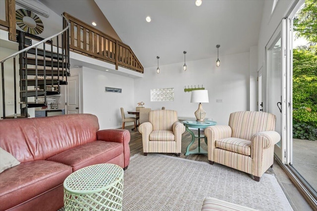 10251 Smith Rd, Union Pier, MI 49129 - living room with high vaulted ceiling, stairs, and wood finished floors
