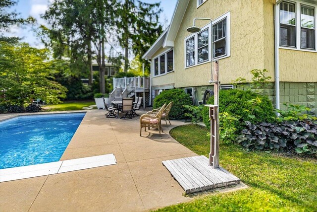 10251 Smith Rd, Union Pier, MI 49129 - swimming pool with a patio area and a deck