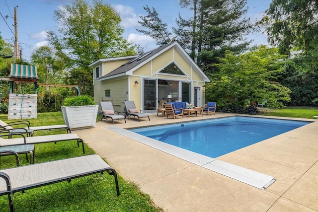 10251 Smith Rd, Union Pier, MI 49129 - outdoor pool with a storage structure, a playground, an outdoor structure, outdoor lounge area, and a patio