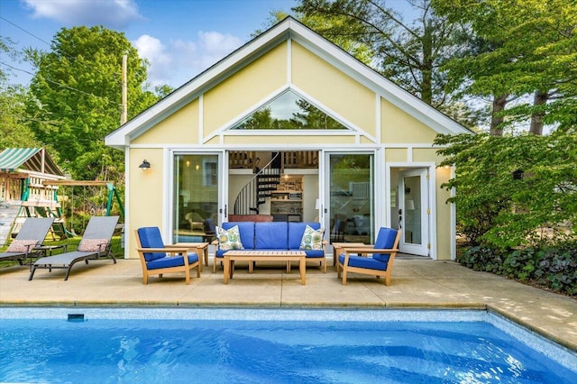 10251 Smith Rd, Union Pier, MI 49129 - back of property with an outdoor hangout area, an outdoor pool, a patio, and stucco siding