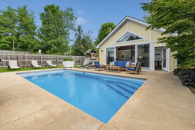 10251 Smith Rd, Union Pier, MI 49129 - view of swimming pool with an outdoor hangout area, a patio area, and a playground