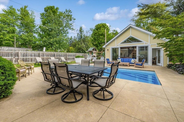 10251 Smith Rd, Union Pier, MI 49129 - view of patio / terrace with an outdoor hangout area, outdoor dining area, and a playground