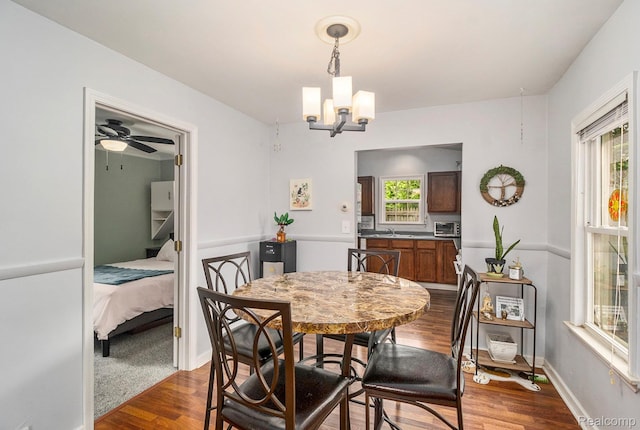 2305 Hester Ct, Keego Harbor, MI 48320 - dining room with a chandelier, dark wood finished floors, and ceiling fan