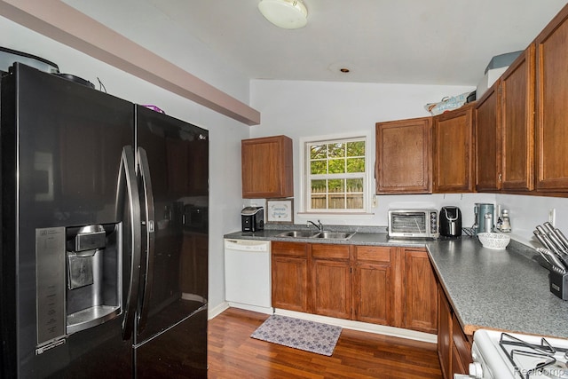 2305 Hester Ct, Keego Harbor, MI 48320 - kitchen featuring white appliances, a sink, vaulted ceiling, dark wood finished floors, and dark countertops