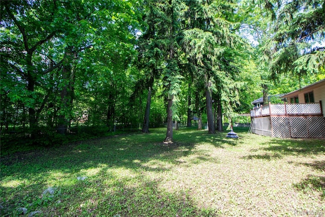 2626 Winter Dr, Troy, MI 48083 - view of grassy yard with a wooden deck