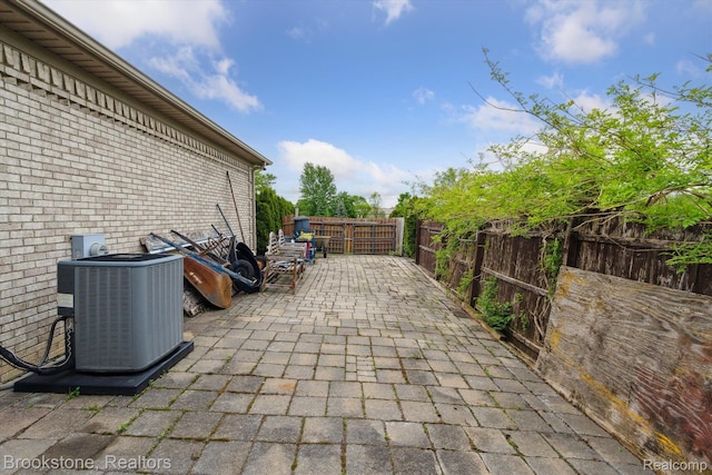 27820 29 Mile Rd, Lenox, MI 48048 - fenced backyard with central AC unit and a patio