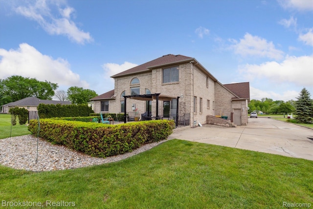 27820 29 Mile Rd, Lenox, MI 48048 - rear view of property with a yard, brick siding, and a patio