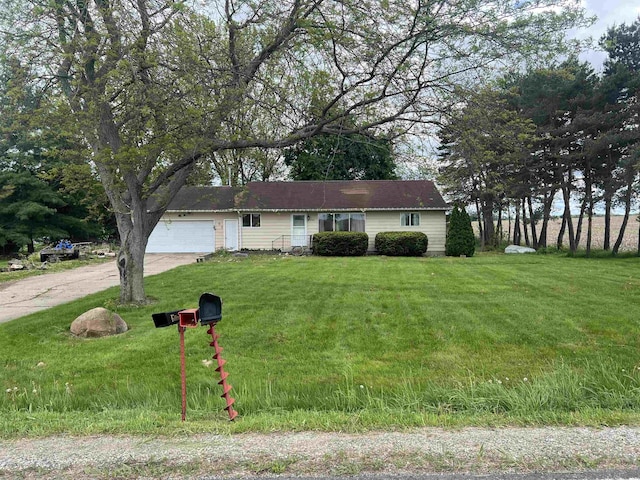 8506 Lytle Rd, Corunna, MI 48817 - ranch-style house featuring driveway, a garage, and a front yard