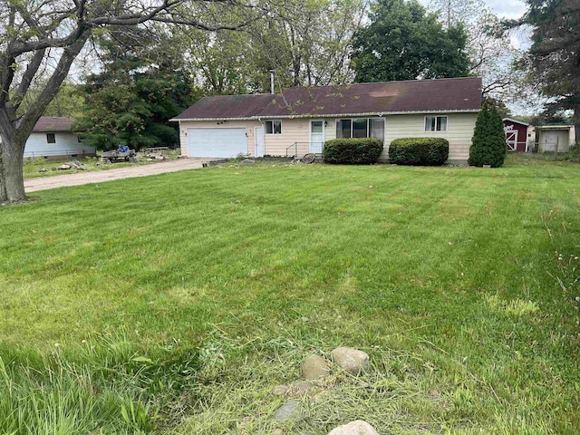 8506 Lytle Rd, Corunna, MI 48817 - single story home with concrete driveway, a garage, and a front yard