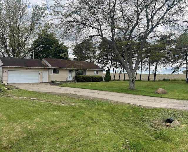 8506 Lytle Rd, Corunna, MI 48817 - single story home with driveway, an attached garage, and a front yard