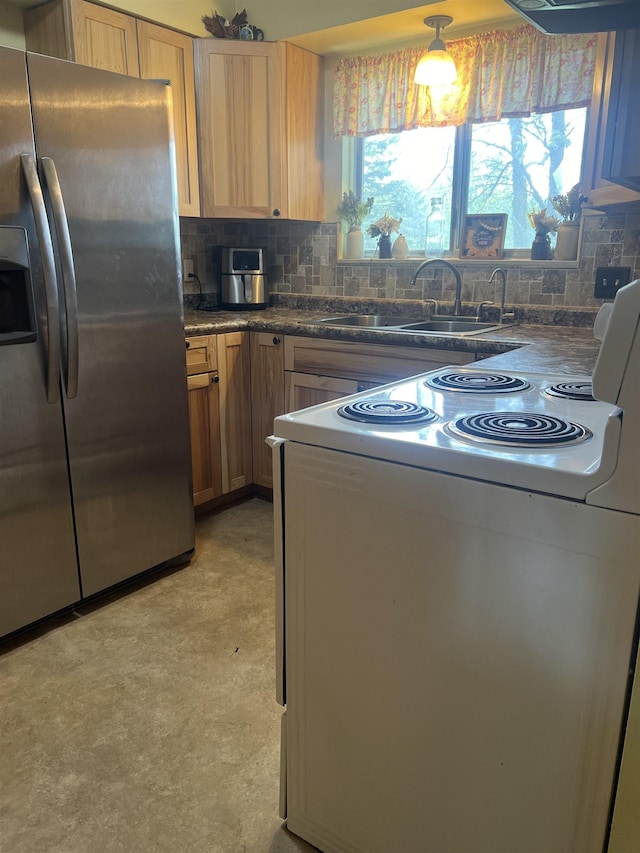 8506 Lytle Rd, Corunna, MI 48817 - kitchen with stainless steel fridge, white electric range oven, a sink, dark countertops, and backsplash