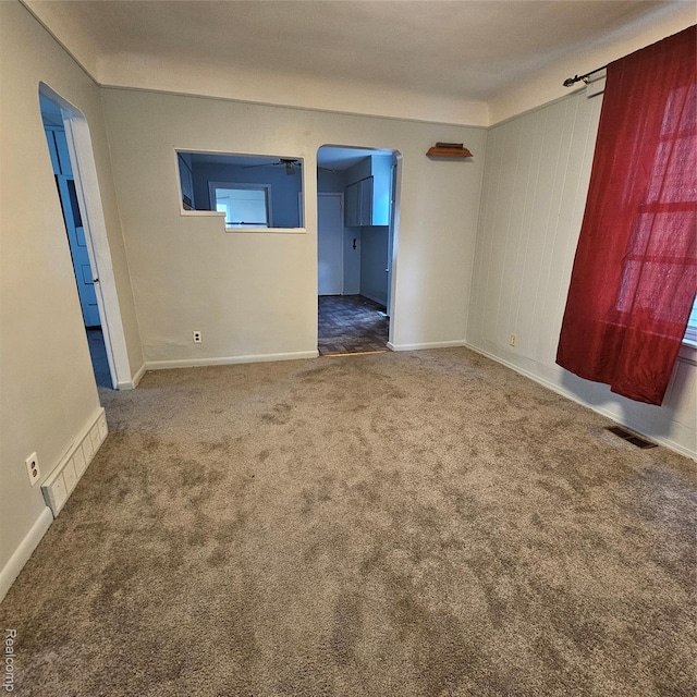2007 Evaline St, Hamtramck, MI 48212 - carpeted empty room with arched walkways and baseboards