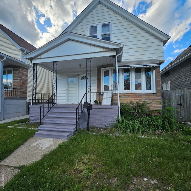 2007 Evaline St, Hamtramck, MI 48212 - view of front of house with a porch