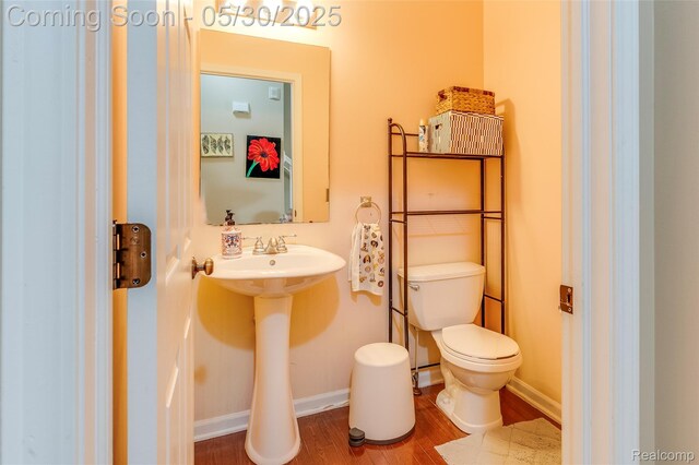 41342 N Maplewood Dr, Canton, MI 48187 - half bath with toilet, wood finished floors, and baseboards