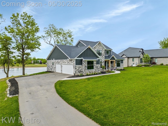 1585 Kriss Crossing Rd, Brighton, MI 48114 - craftsman inspired home with board and batten siding, stone siding, driveway, a front yard, and a water view