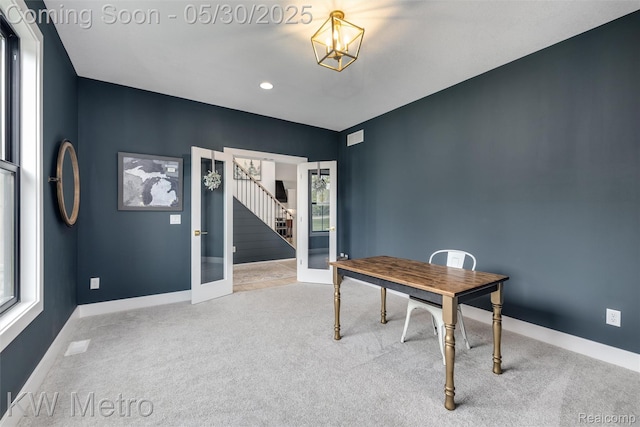 1585 Kriss Crossing Rd, Brighton, MI 48114 - home office with french doors, carpet flooring, a chandelier, and baseboards