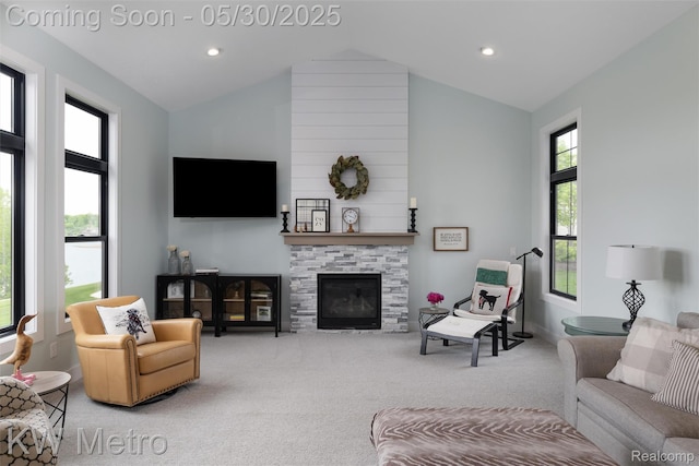 1585 Kriss Crossing Rd, Brighton, MI 48114 - carpeted living room with vaulted ceiling, a glass covered fireplace, recessed lighting, and baseboards