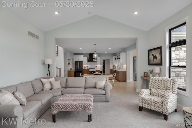 1585 Kriss Crossing Rd, Brighton, MI 48114 - living area featuring lofted ceiling, recessed lighting, and light colored carpet