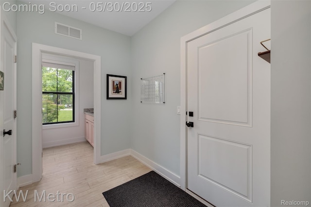 1585 Kriss Crossing Rd, Brighton, MI 48114 - entryway with light wood finished floors and baseboards