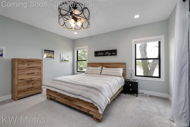 1585 Kriss Crossing Rd, Brighton, MI 48114 - bedroom featuring light carpet, a chandelier, baseboards, and recessed lighting